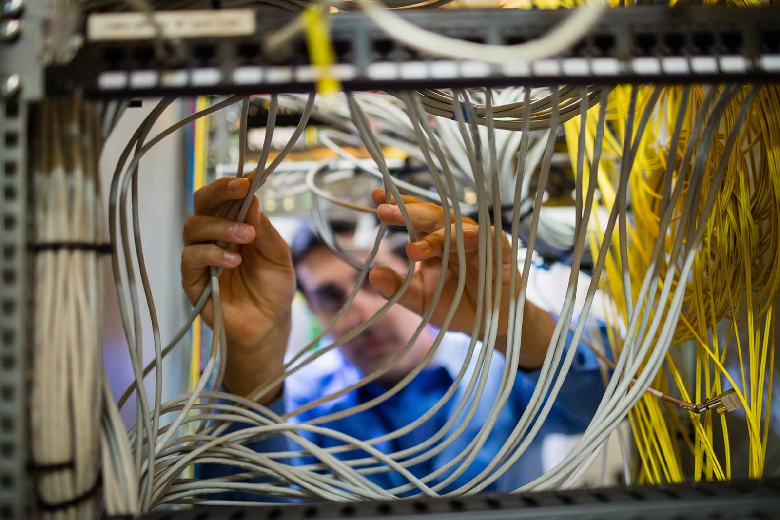 technician-fixing-cable-53FEWDW.jpg